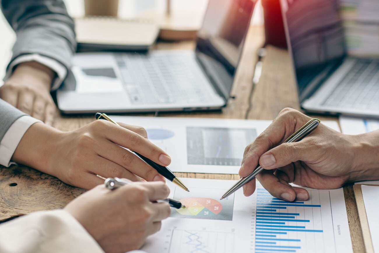Business,Team,Working,On,Calculators,And,Business,Graph,Charts.,Financial