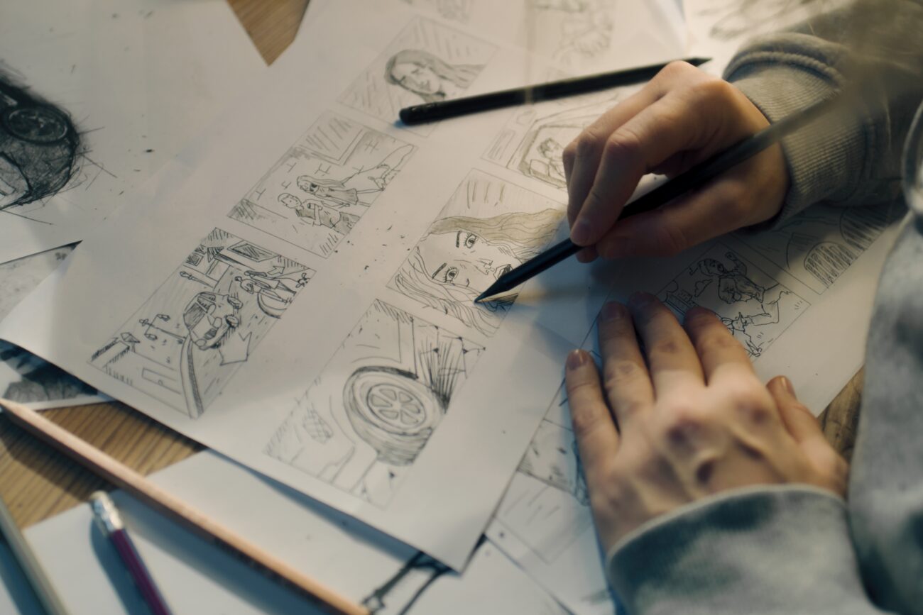 Young,Female,Artist,Draws,Sketches,Of,Comic,Book,Characters,On